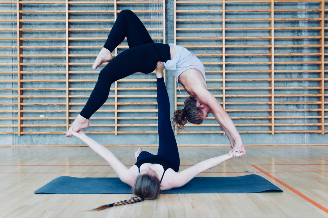 Young couple doing acro yoga concept Royalty Free Vector
